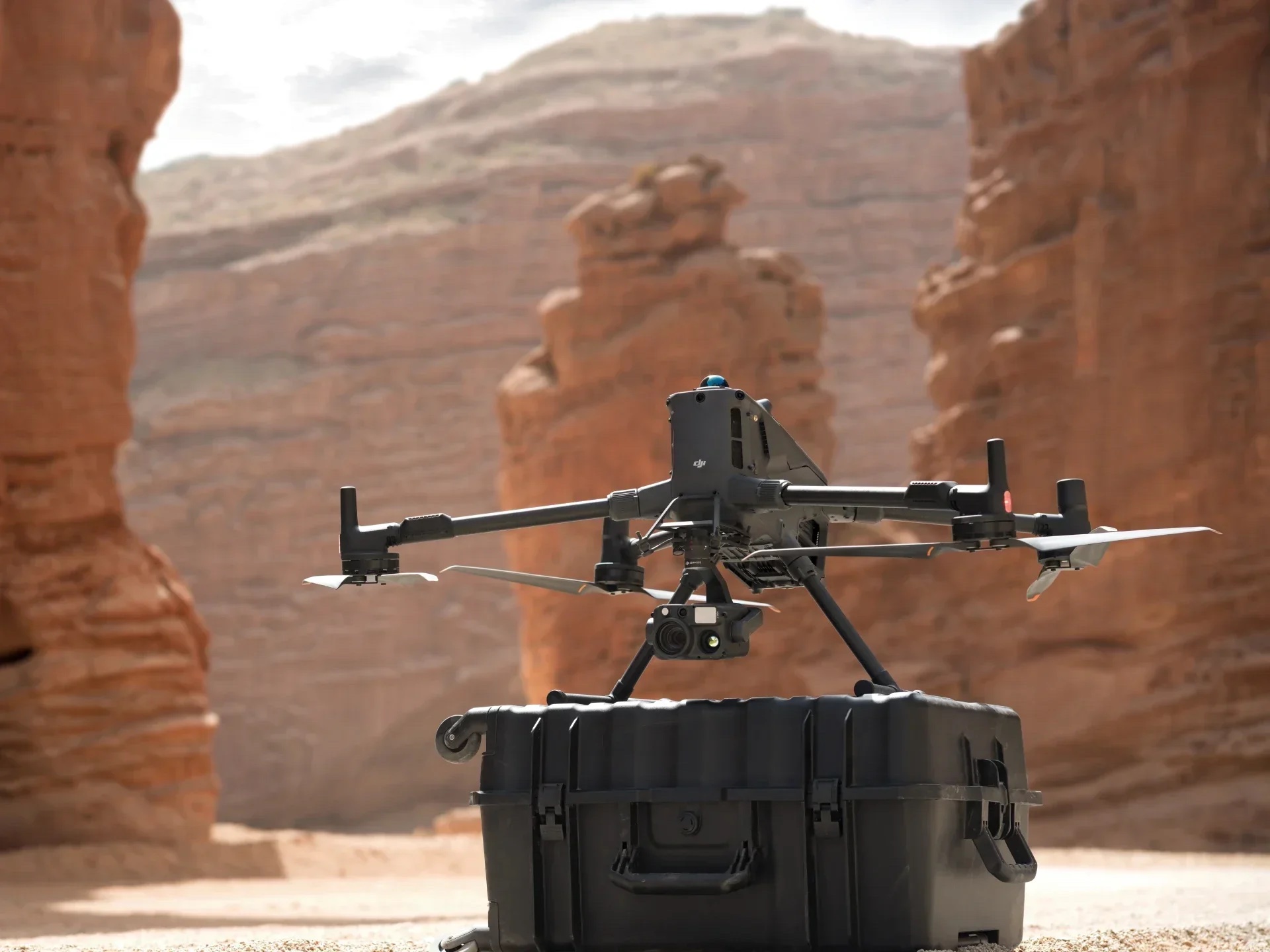 DJI Matrice 400 in flight over desert canyon terrain